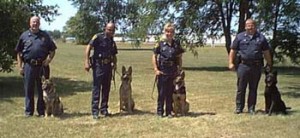 Class of 8-99 Chief Ray Saylor & K-9 Jordy- Lanesville Indiana Police Dept. Eddie Redds & K-9 Jerry - Flint Michigan Police Dept. Esther Bernritter & K-9 Reno - Flint Michigan Police Dept. Kent Ater & K-9 Aron - Lanesville Indiana Police Dept.